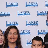 Family of four posing together